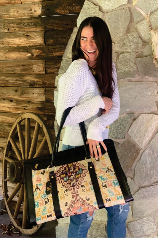 hand bag is made with high quality leather and vintage carpets.